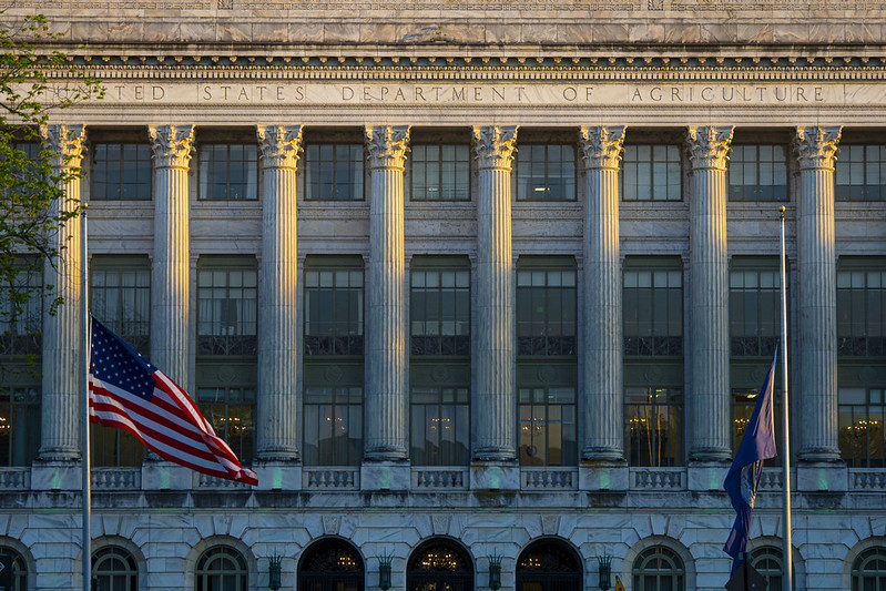 Outside of the USDA building illuminated green for a celebration in 2021.